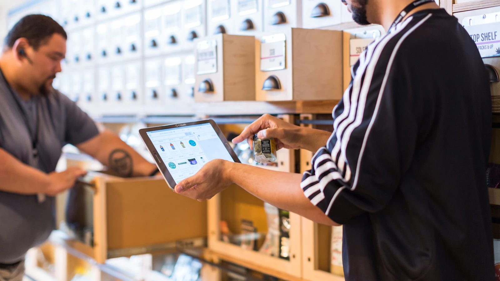 Small business owners using AI tools on a tablet
